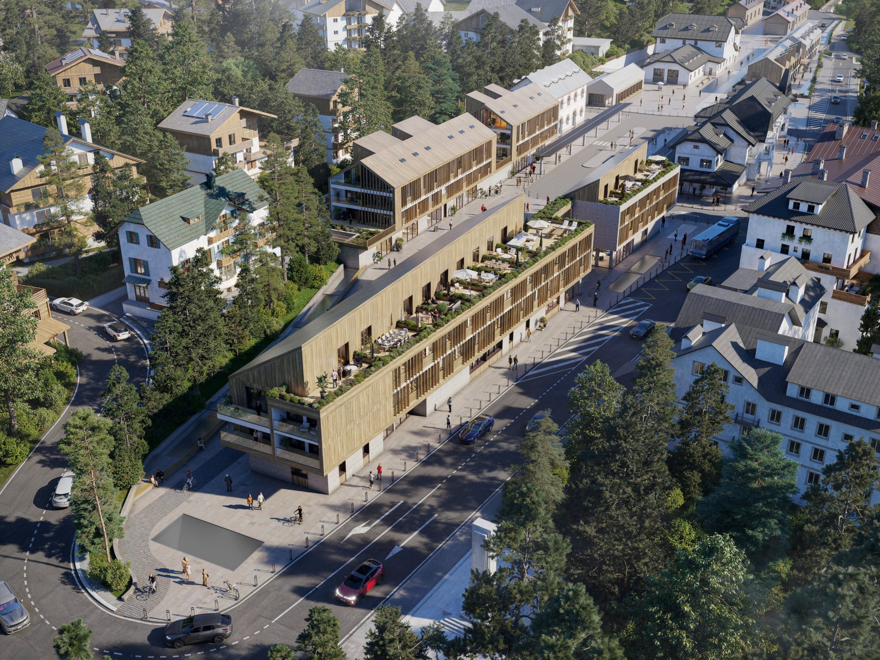 «Le Vette» Cortina City Hub dall'alto: gli edifici in legno lungo la strada